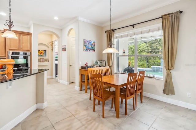 1429 Arbitus Cir, Oviedo, FL 32765 - dining space with ornamental molding, arched walkways, light tile patterned floors, baseboards, and recessed lighting