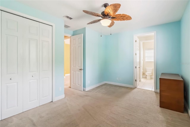 1429 Arbitus Cir, Oviedo, FL 32765 - unfurnished bedroom featuring carpet, a closet, baseboards, ensuite bathroom, and ceiling fan