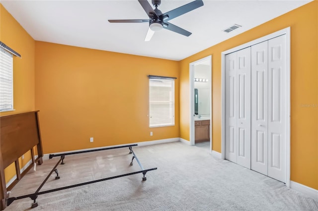 1429 Arbitus Cir, Oviedo, FL 32765 - unfurnished bedroom featuring carpet flooring, a closet, baseboards, and a ceiling fan