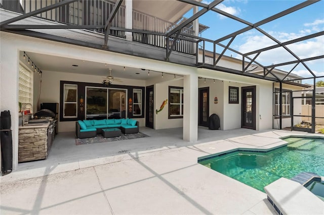 1429 Arbitus Cir, Oviedo, FL 32765 - view of swimming pool featuring a patio area, an outdoor hangout area, exterior kitchen, and a ceiling fan