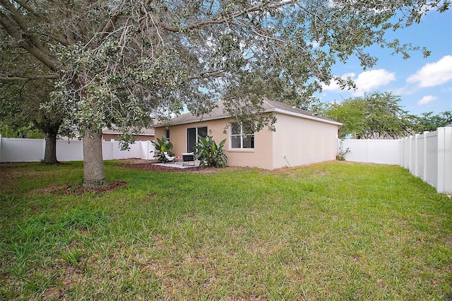 2306 Valhalla Dr, Tavares, FL 32778 - back of property with stucco siding