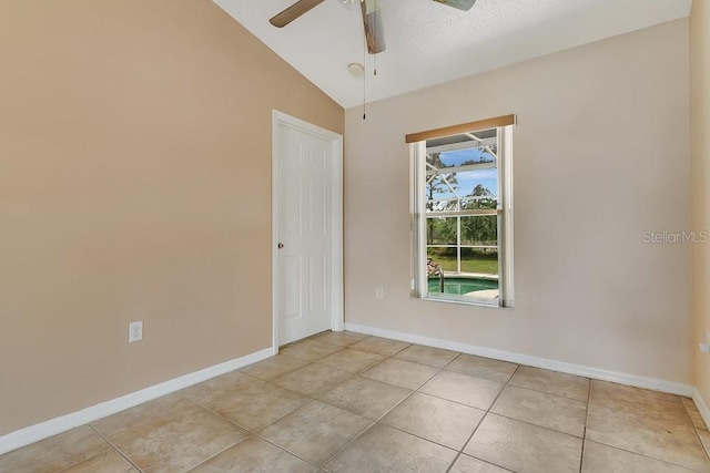 2772 Pelham Cir, Deltona, FL 32738 - spare room featuring a ceiling fan, baseboards, lofted ceiling, and light tile patterned floors