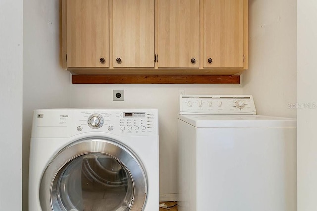 2772 Pelham Cir, Deltona, FL 32738 - washroom featuring washer and clothes dryer and cabinet space