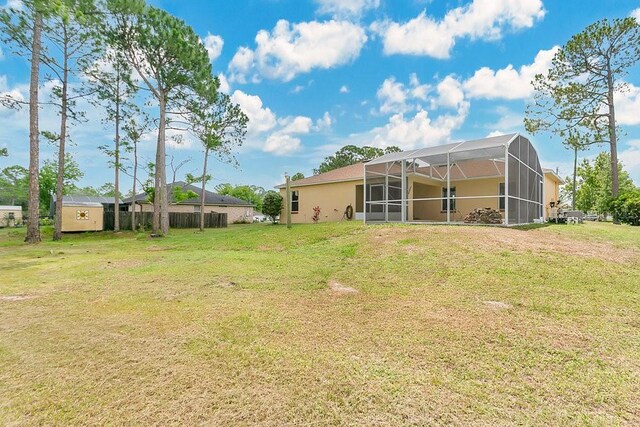 2772 Pelham Cir, Deltona, FL 32738 - view of grassy yard featuring a lanai