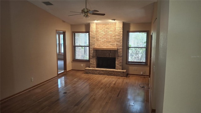 900 Red Fox Rd, Altamonte Springs, FL 32714 - unfurnished living room featuring hardwood / wood-style flooring, a ceiling fan, baseboards, a brick fireplace, and lofted ceiling