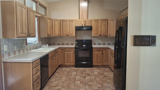 900 Red Fox Rd, Altamonte Springs, FL 32714 - kitchen featuring black appliances, exhaust hood, tile counters, brick patterned flooring, and vaulted ceiling