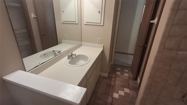 900 Red Fox Rd, Altamonte Springs, FL 32714 - bathroom with vanity, baseboards, and tile patterned floors