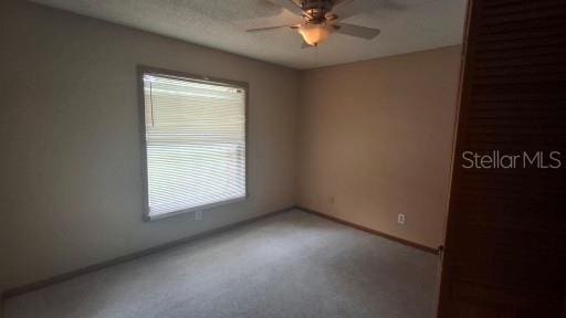900 Red Fox Rd, Altamonte Springs, FL 32714 - carpeted empty room with ceiling fan and baseboards