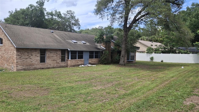 900 Red Fox Rd, Altamonte Springs, FL 32714 - rear view of property with brick siding and roof with shingles