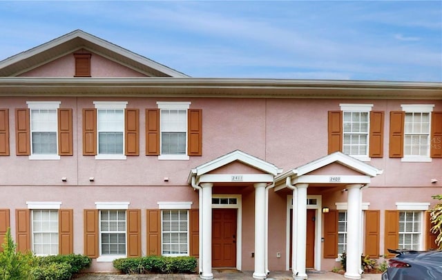 2411 Caravelle Cir, Kissimmee, FL 34746 - view of front of house with stucco siding