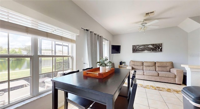 2411 Caravelle Cir, Kissimmee, FL 34746 - dining space with light tile patterned flooring, lofted ceiling, and a ceiling fan
