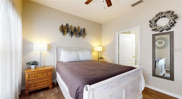 2411 Caravelle Cir, Kissimmee, FL 34746 - bedroom featuring wood finished floors and baseboards