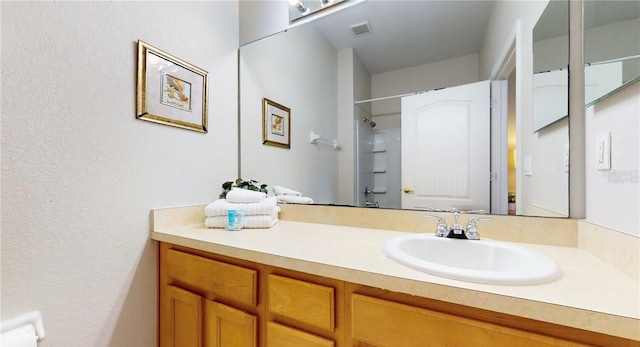 2411 Caravelle Cir, Kissimmee, FL 34746 - full bath featuring a shower, vanity, and a textured wall