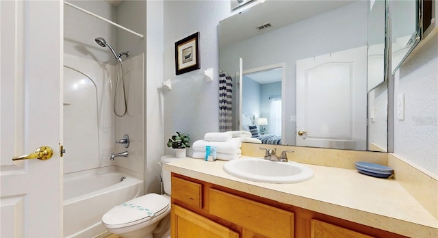 2411 Caravelle Cir, Kissimmee, FL 34746 - full bathroom with vanity, shower / bathtub combination, and toilet