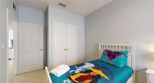 2411 Caravelle Cir, Kissimmee, FL 34746 - carpeted bedroom with a closet and freestanding refrigerator