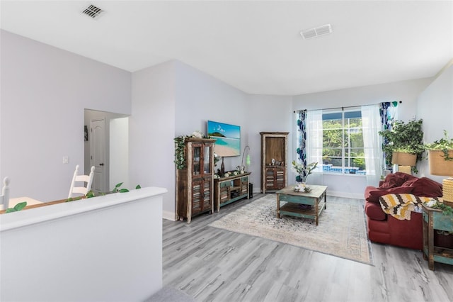10743 Fairhaven Way, Orlando, FL 32825 - living room with light wood-style floors and baseboards