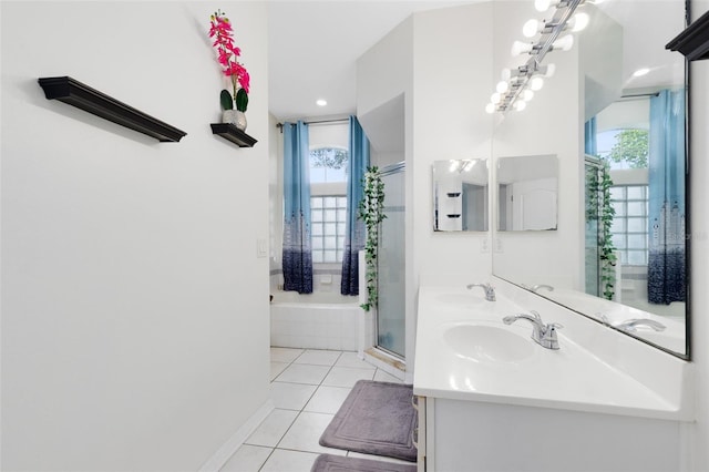 10743 Fairhaven Way, Orlando, FL 32825 - full bathroom with plenty of natural light, tile patterned flooring, double vanity, and an enclosed shower