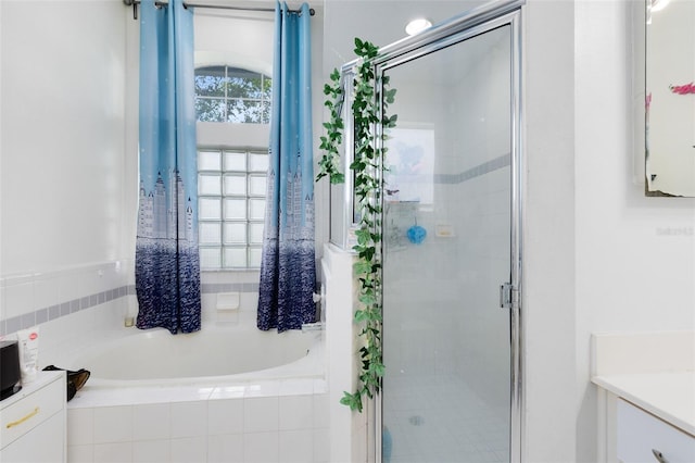 10743 Fairhaven Way, Orlando, FL 32825 - bathroom with vanity, a bath, and a stall shower