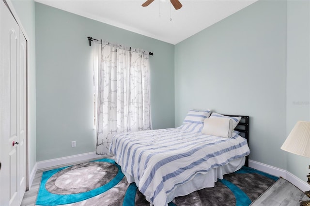 10743 Fairhaven Way, Orlando, FL 32825 - bedroom with baseboards, wood finished floors, and a ceiling fan