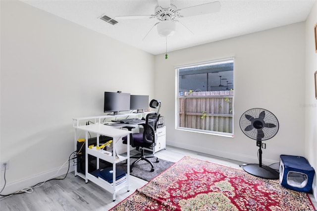 10743 Fairhaven Way, Orlando, FL 32825 - office area featuring light wood finished floors, ceiling fan, and baseboards