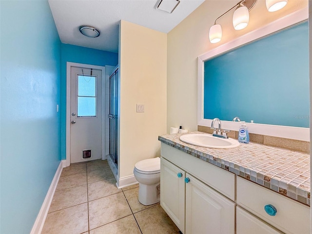 10743 Fairhaven Way, Orlando, FL 32825 - full bathroom with toilet, a shower stall, vanity, tile patterned floors, and baseboards