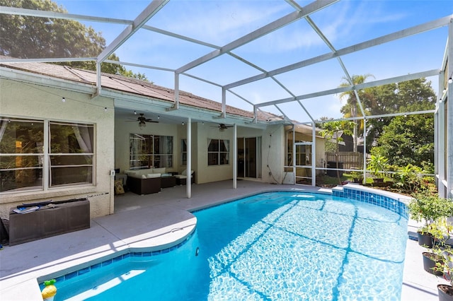 10743 Fairhaven Way, Orlando, FL 32825 - view of swimming pool featuring a ceiling fan, an outdoor hangout area, a patio area, and glass enclosure