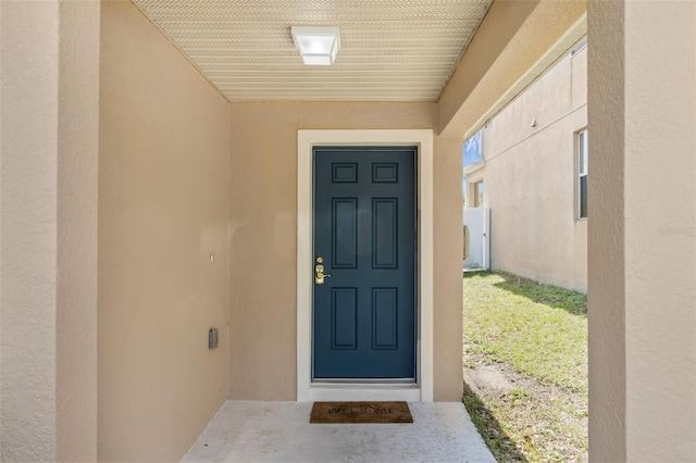 126 San Carlo Rd, Davenport, FL 33896 - property entrance with stucco siding