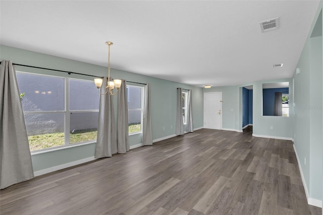 126 San Carlo Rd, Davenport, FL 33896 - spare room with a chandelier, wood finished floors, baseboards, and plenty of natural light