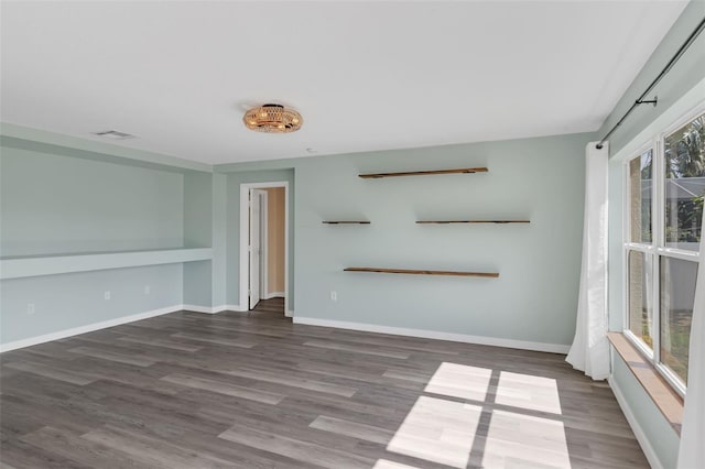 126 San Carlo Rd, Davenport, FL 33896 - unfurnished living room with wood finished floors and baseboards