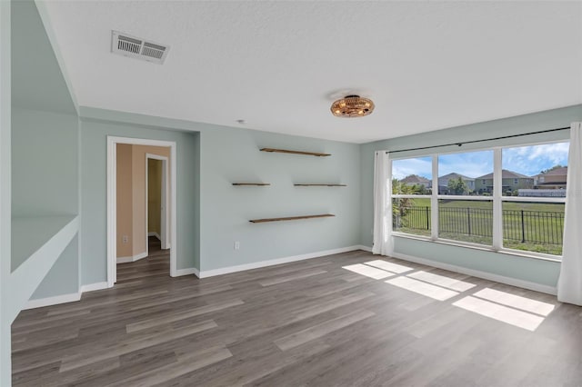 126 San Carlo Rd, Davenport, FL 33896 - unfurnished living room with wood finished floors and baseboards