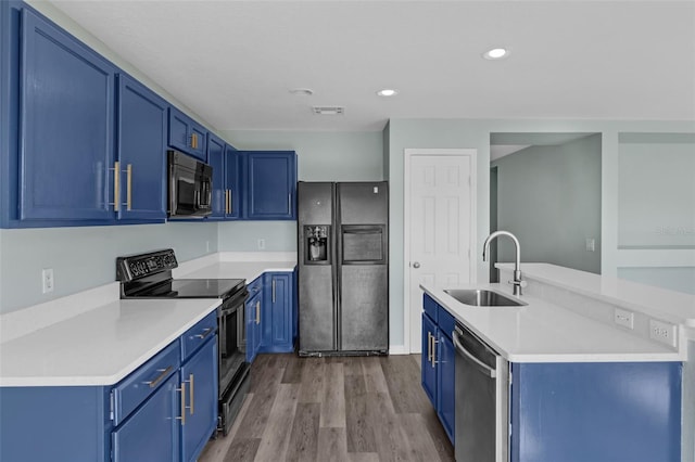 126 San Carlo Rd, Davenport, FL 33896 - kitchen featuring refrigerator with ice dispenser, a sink, black range with electric cooktop, stainless steel dishwasher, and blue cabinetry