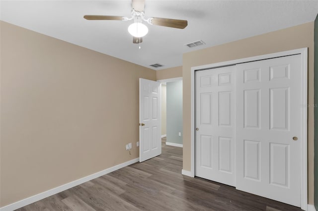 126 San Carlo Rd, Davenport, FL 33896 - unfurnished bedroom featuring wood finished floors, baseboards, a closet, and ceiling fan