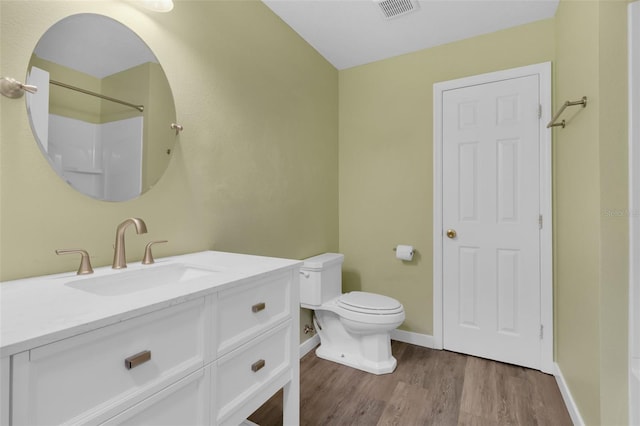 126 San Carlo Rd, Davenport, FL 33896 - bathroom featuring baseboards, wood finished floors, vanity, toilet, and a shower