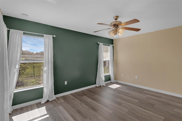 126 San Carlo Rd, Davenport, FL 33896 - empty room featuring wood finished floors, a ceiling fan, and baseboards