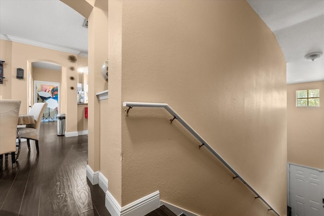 173 Villa Di Este Ter Unit 209, Lake Mary, FL 32746 - staircase with arched walkways, wood finished floors, baseboards, and ornamental molding