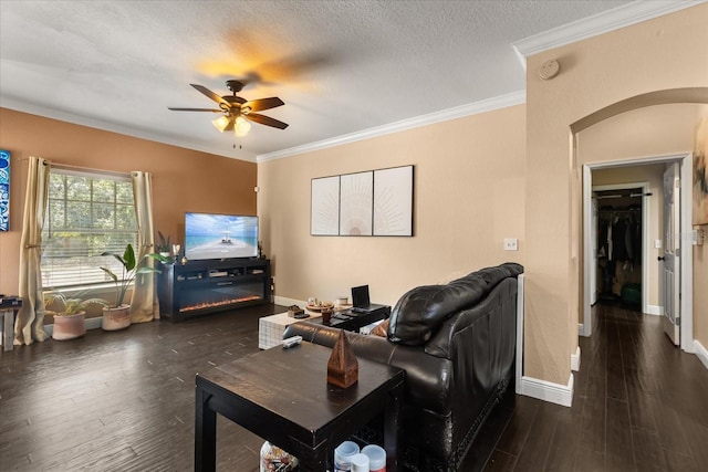 173 Villa Di Este Ter Unit 209, Lake Mary, FL 32746 - living room featuring arched walkways, ceiling fan, wood finished floors, ornamental molding, and baseboards