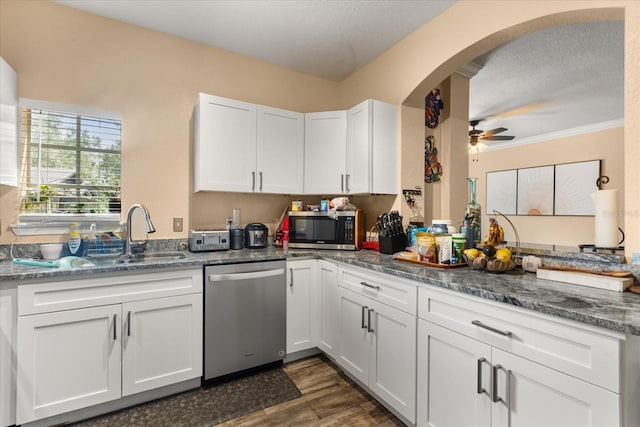 173 Villa Di Este Ter Unit 209, Lake Mary, FL 32746 - kitchen featuring stainless steel appliances, white cabinetry, arched walkways, a ceiling fan, and dark wood-type flooring