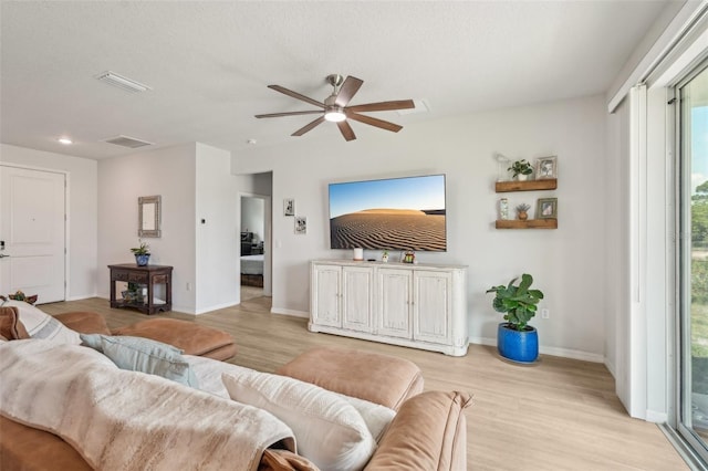 1909 Thomasville Ave SE, Palm Bay, FL 32909 - living area with light wood-type flooring, a ceiling fan, baseboards, and recessed lighting
