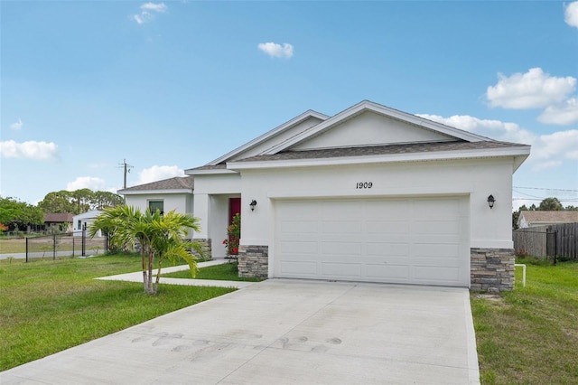 1909 Thomasville Ave SE, Palm Bay, FL 32909 - single story home featuring stucco siding, stone siding, driveway, an attached garage, and roof with shingles
