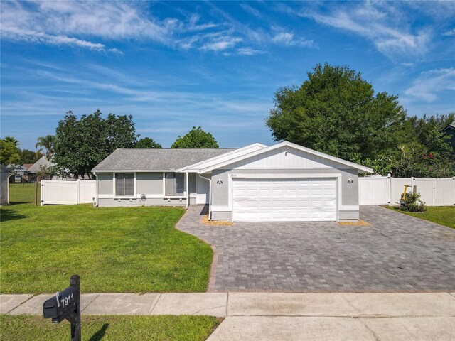 7911 Murcott Cir, Orlando, FL 32835 - single story home with decorative driveway and a garage