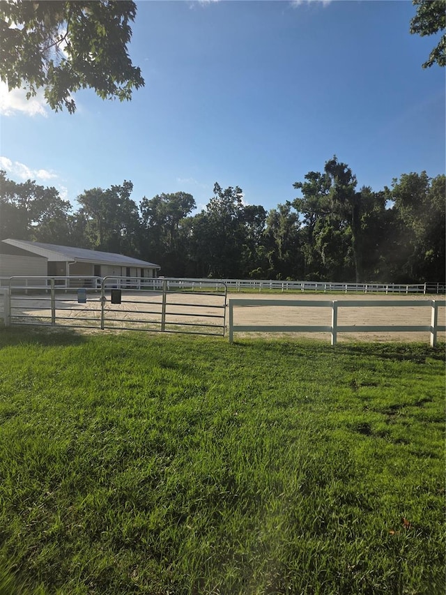 109 Crown Oaks Way Unit 109, Longwood, FL 32779 - view of green lawn featuring an outdoor riding arena and a view of countryside