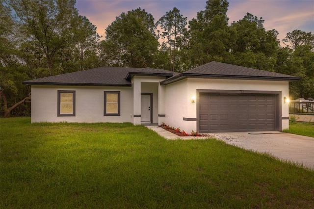 8944 N Pitcairn Way, Citrus Springs, FL 34434 - prairie-style home featuring stucco siding, concrete driveway, a garage, and a front lawn