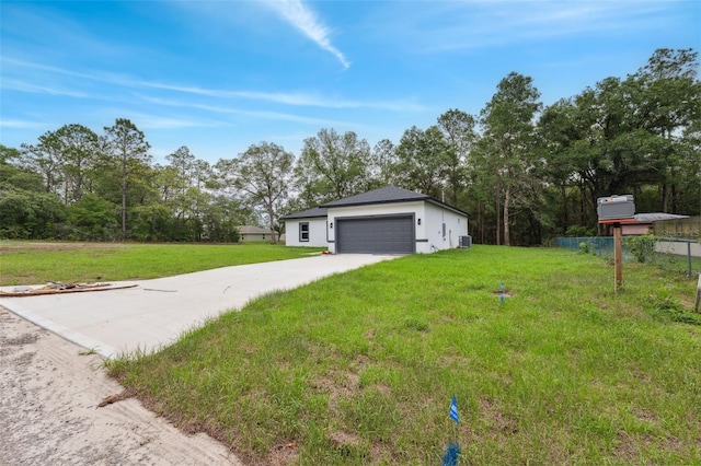 8944 N Pitcairn Way, Citrus Springs, FL 34434 - view of yard featuring a garage, concrete driveway, and view of scattered trees
