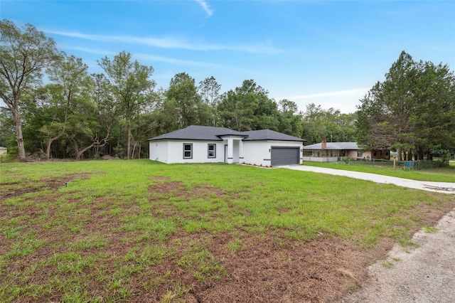 8944 N Pitcairn Way, Citrus Springs, FL 34434 - view of front of home with concrete driveway, an attached garage, and stucco siding