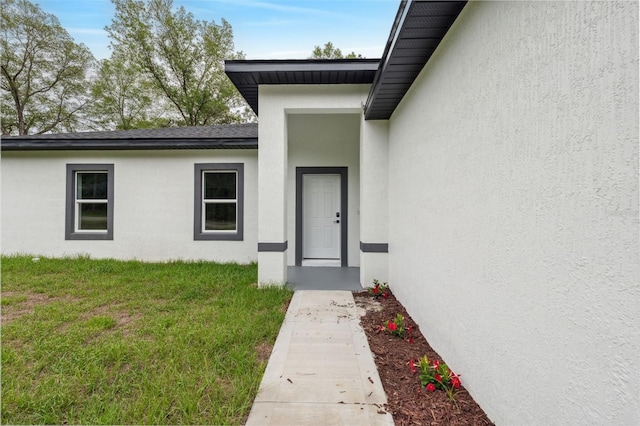 8944 N Pitcairn Way, Citrus Springs, FL 34434 - property entrance with stucco siding and a yard