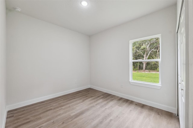 8944 N Pitcairn Way, Citrus Springs, FL 34434 - spare room featuring baseboards, light wood-style floors, a smoke detector, and recessed lighting