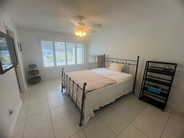 2426 Windward Way, Winter Park, FL 32792 - bedroom featuring baseboards, a textured ceiling, light tile patterned flooring, and ceiling fan