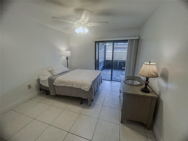 2426 Windward Way, Winter Park, FL 32792 - bedroom with access to exterior, a ceiling fan, light tile patterned flooring, baseboards, and a textured ceiling