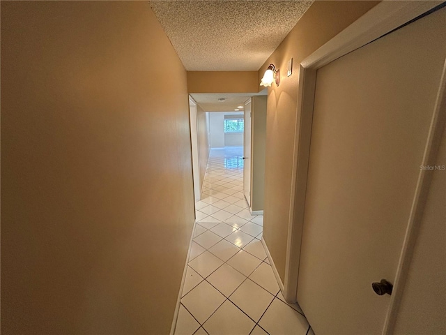 510 Cranes Way Unit 302, Altamonte Springs, FL 32701 - hallway featuring light tile patterned floors and a textured ceiling