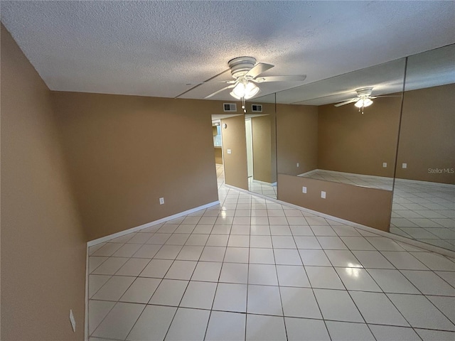 510 Cranes Way Unit 302, Altamonte Springs, FL 32701 - unfurnished room featuring ceiling fan, a textured ceiling, light tile patterned floors, and baseboards